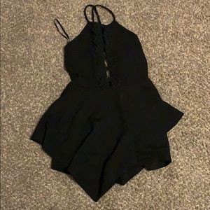 Black romper with eyelet cutouts